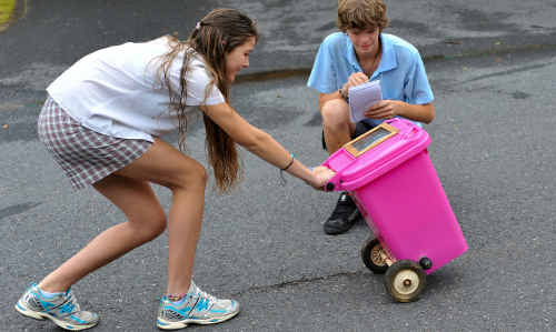Young inventors: Niabie Squires and Connor Cheers with their solar-powered wheelie bin. Young inventors: Niabie Squires and Connor Cheers with their solar-powered wheelie bin.